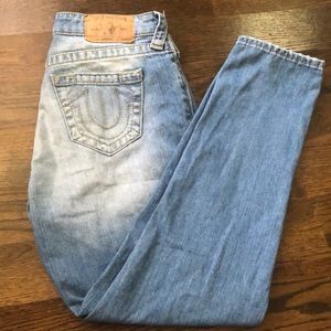 True religion light blue distressed jeans.